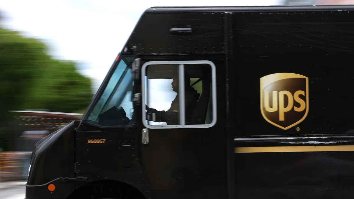 A UPS delivery truck drives through an intersection on June 12, 2023 in San Francisco, California.