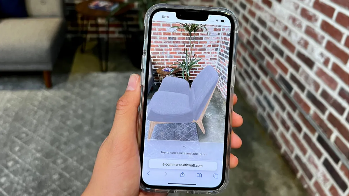 Close up of smart phone using augmented reality to shop for chair.