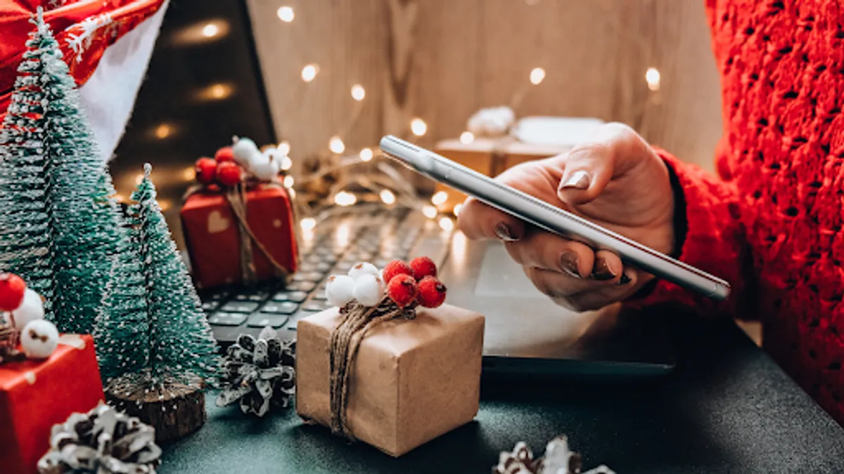 Female buyer makes order on mobile phone.