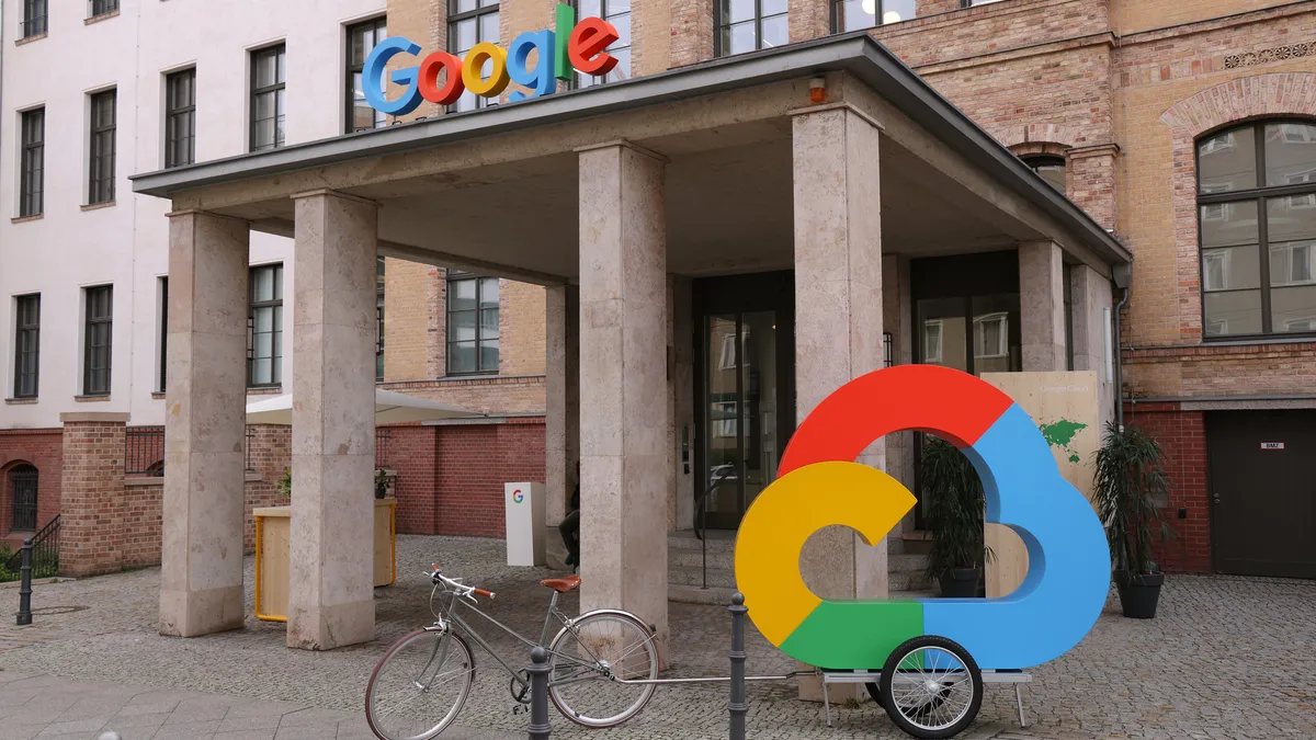 The Google corporate logo and Google Cloud logo stand outside the Google Germany offices on August 31, 2021 in Berlin, Germany.