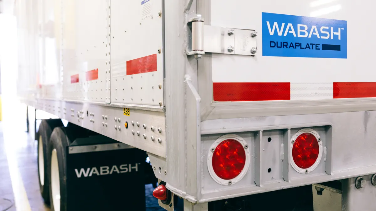 A freight truck with the blue Wabash logo on the lower left corner.