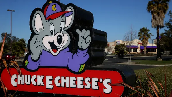 A Chuck E. Cheese sign.