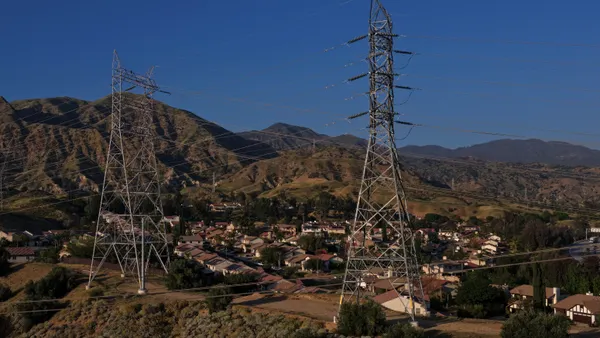 Electrical transmission lines hang over a housing development on March 24, 2026, in Sylmar, California.