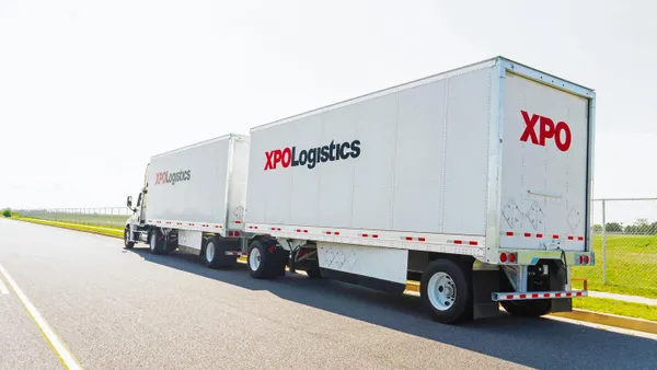An XPO Logistics truck on the road.