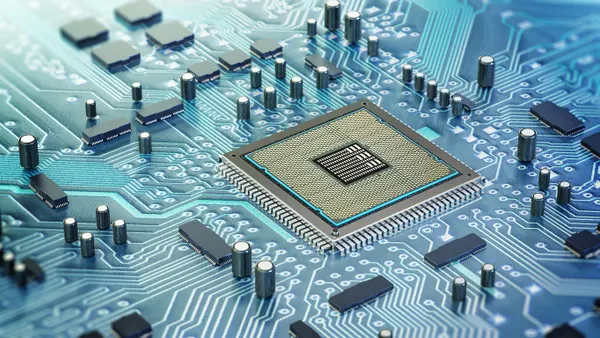Detailed architecture of a computer chip nestled on a circuit board.