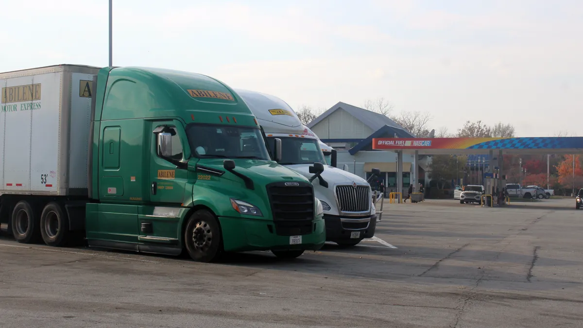 Tractor-trailers parked near a gas station on the Pennsylvania Turnpike in 2024.