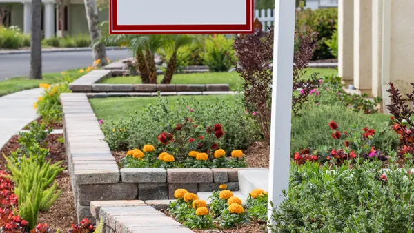 For Sale Real Estate Sign in Front of New House