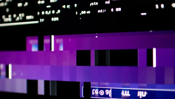 A close-up of a computer screen with blocks of block and missing data code. 