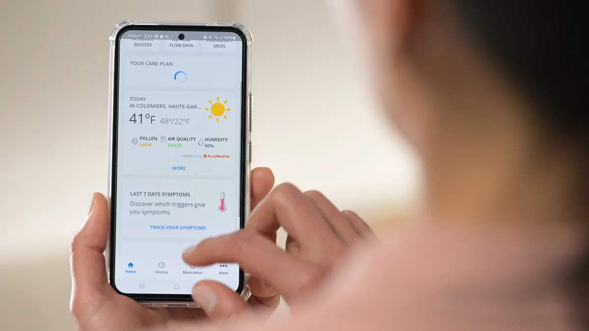 women using health app on phone