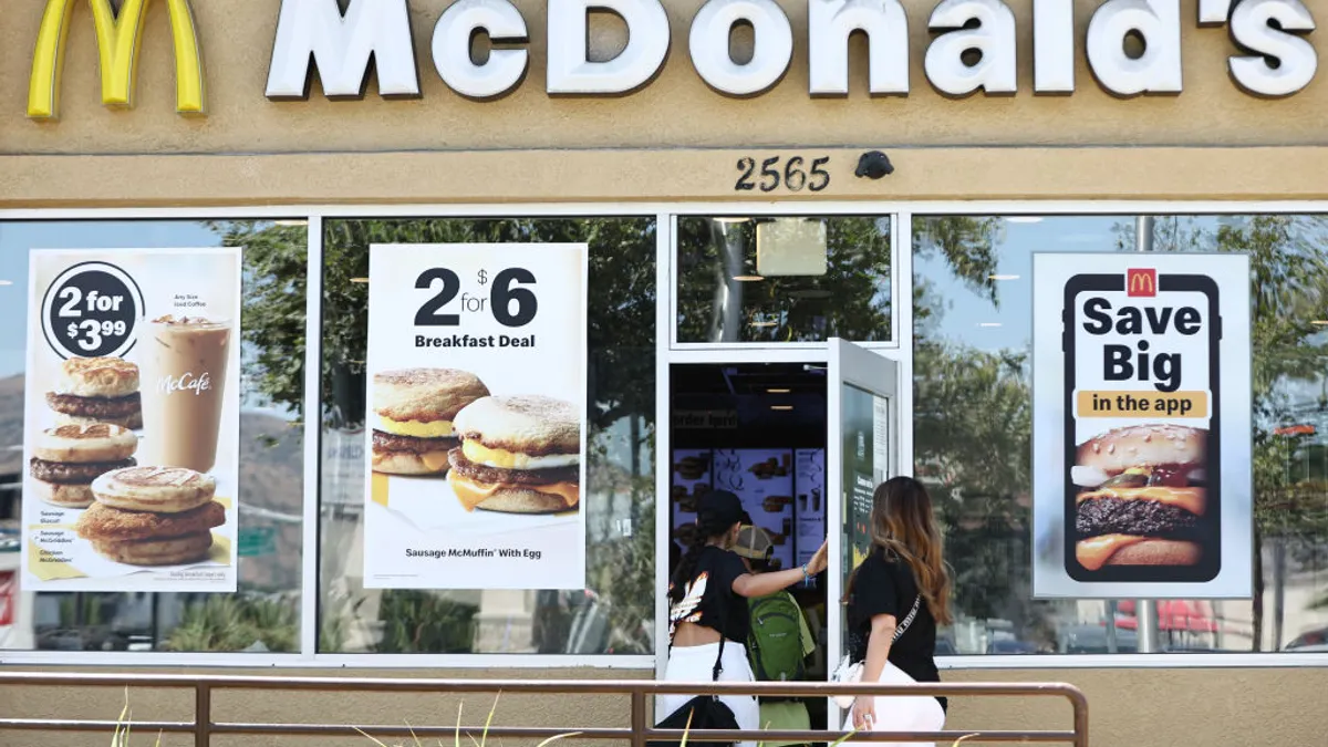 Customers enter a McDonald's restaurant.