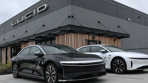 Brand new Lucid electric cars sit parked in front of a Lucid Studio showroom on May 24, 2024, in San Francisco, California.