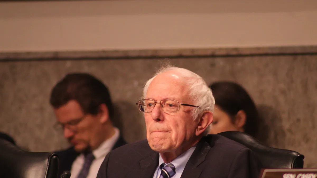 Sen. Bernie Sanders address Howard Schultz at a hearing of the Senate committee on Health, Education, Labor and Pensions