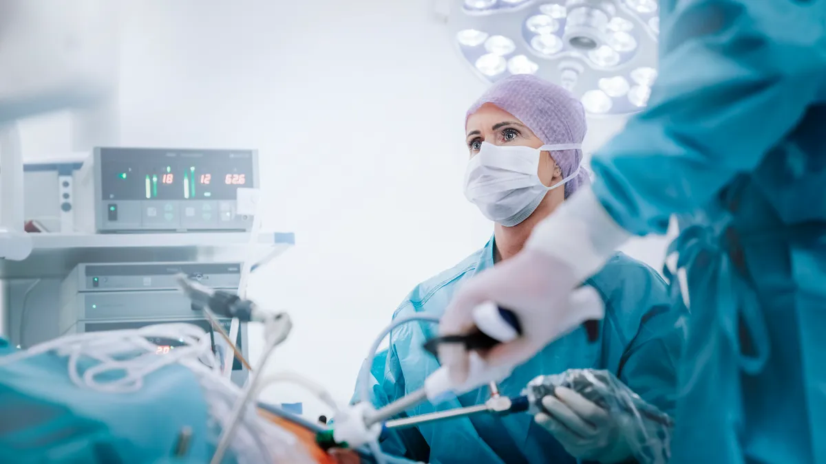 A surgeon performing an operation in a  studio photo