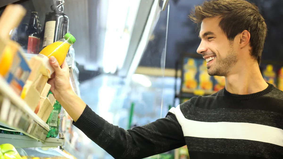 Man buying orange juice