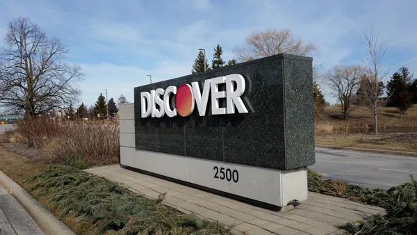 A sign that reads "Discover" marks the entrance to the card company's headquarters in Illinois.