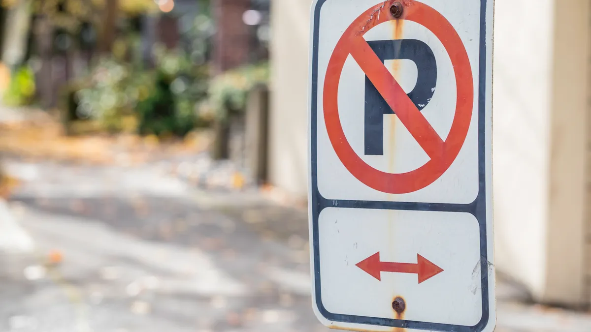 A no parking sign in a city.