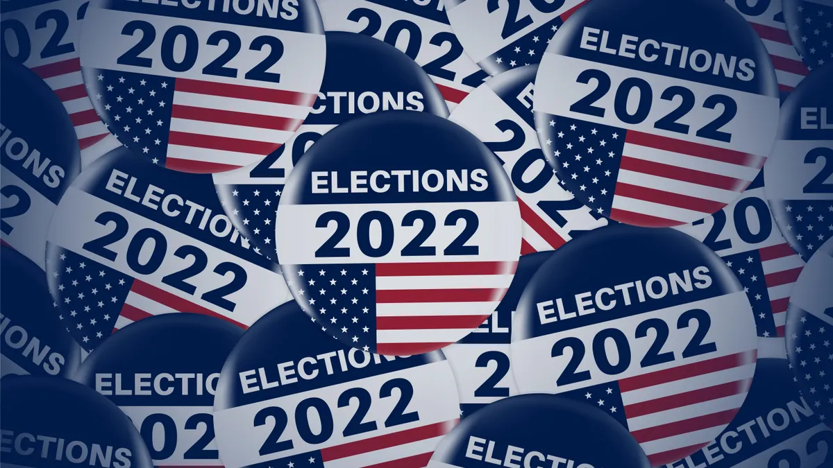 A creative image displaying circular 2022 election pins.