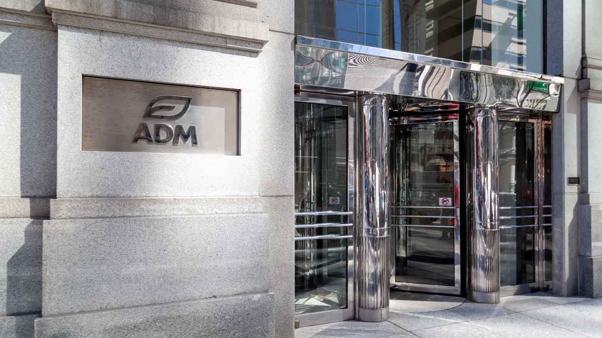 Chicago, Illinois, USA - March 28, 2022: ADM logo displayed at the entrance to its headquarters in Chicago. ADM is an American multinational food processing and commodities trading corporation.