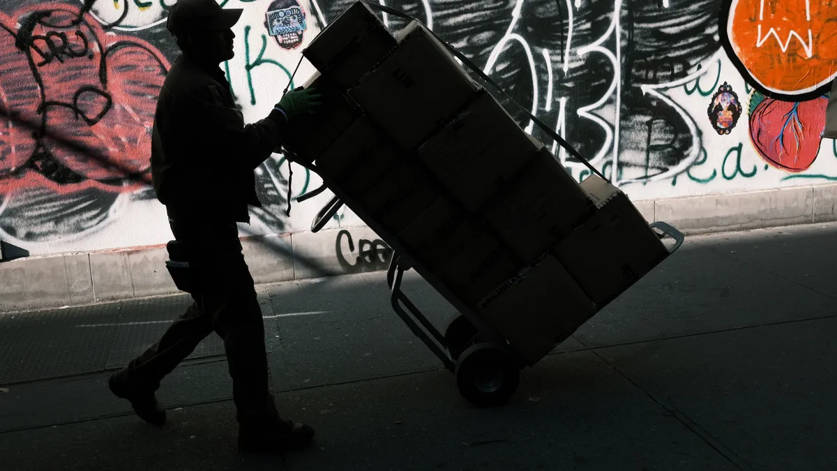 A man moves a box on November 21, 2019 in New York City.