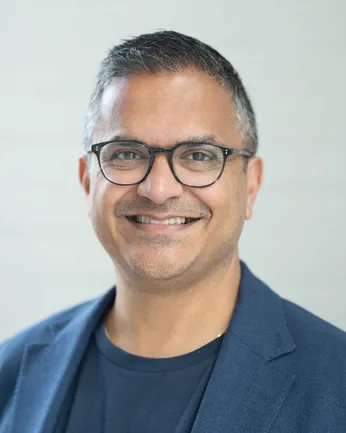 Headshot of a man in a suit.