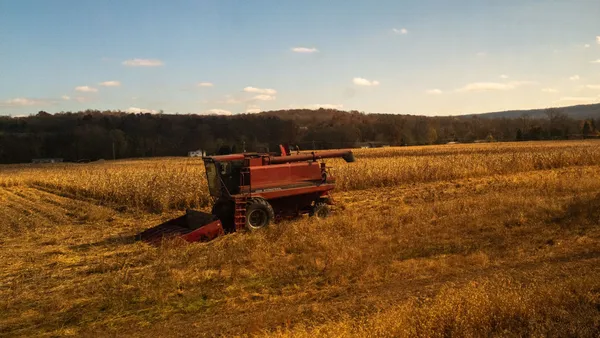 Farm equipment sits in a field