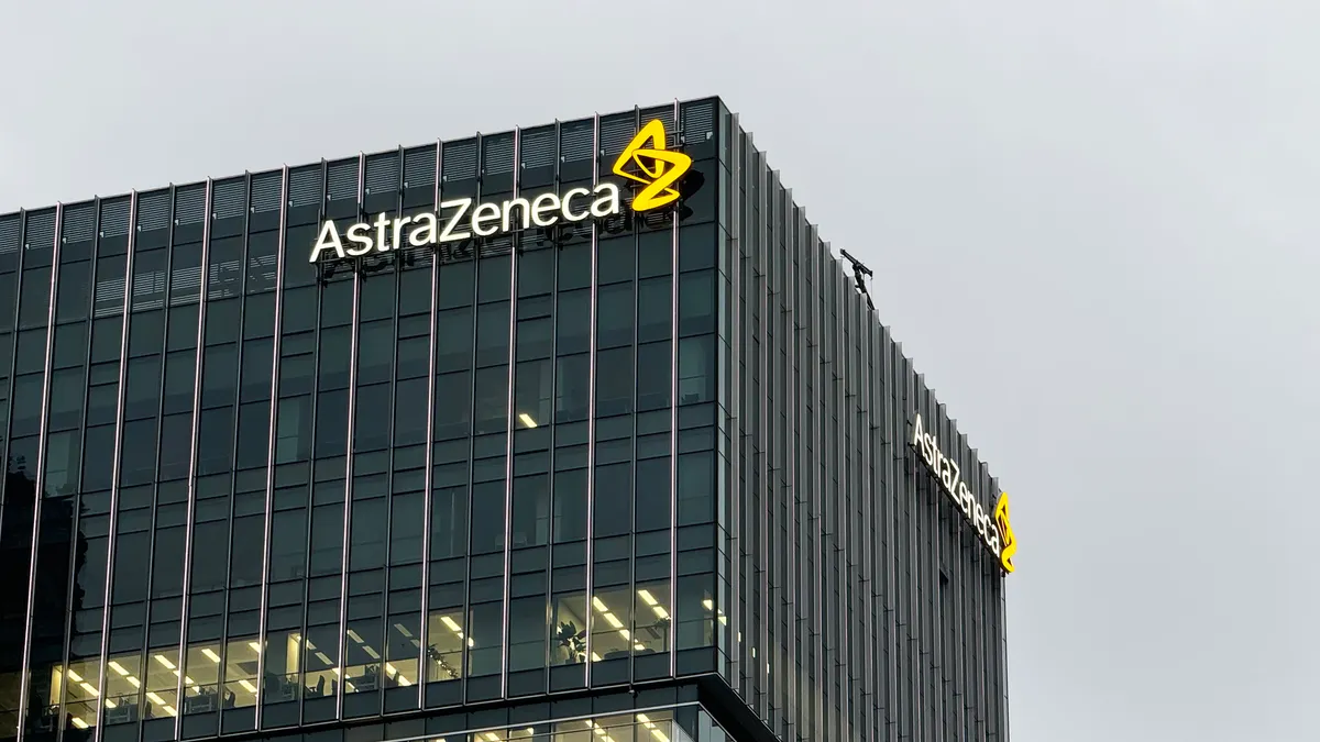 An AstraZeneca logo stands atop an office building in Shanghai, China.