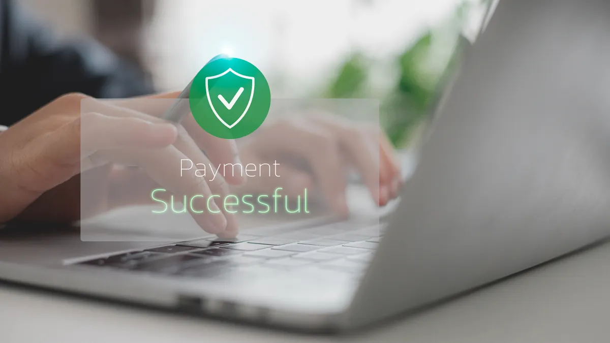 Payment successful icon over a laptop