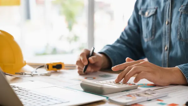 Man calculating budgets for construction projects.