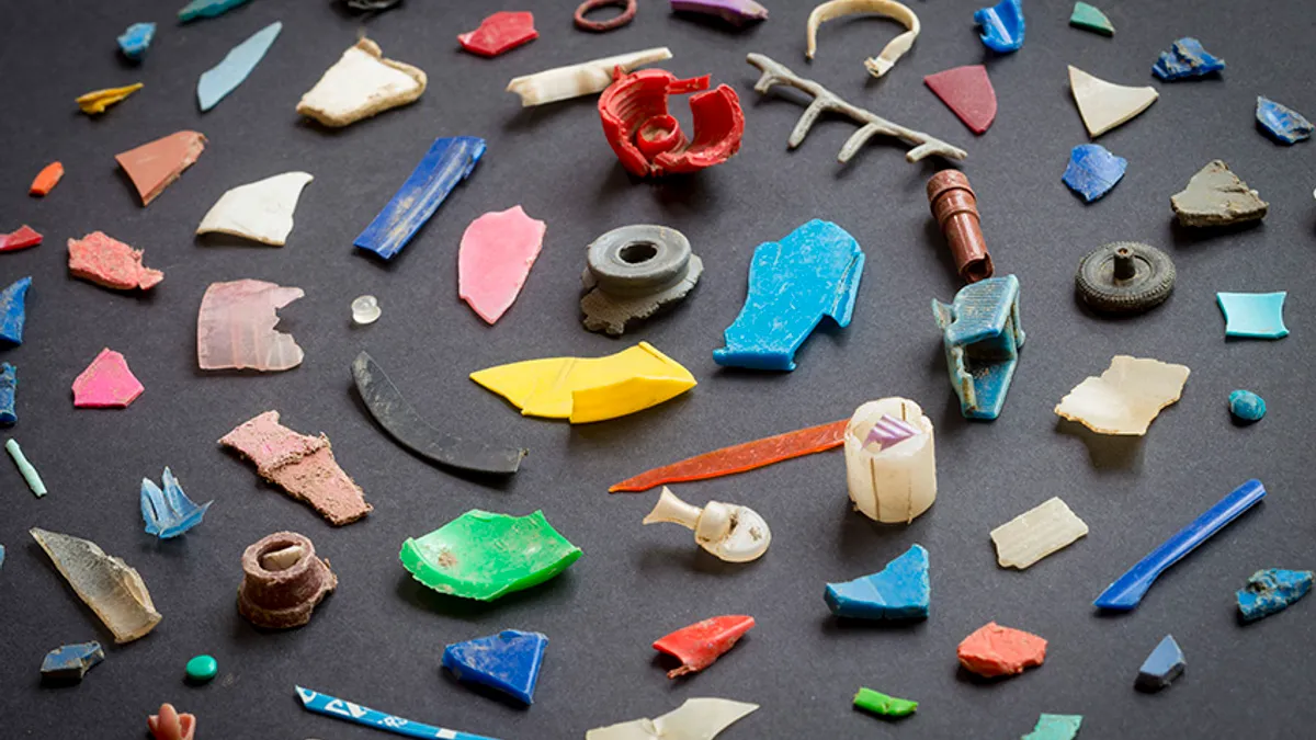 Plastic fragments arranged in a spiral on a flat surface