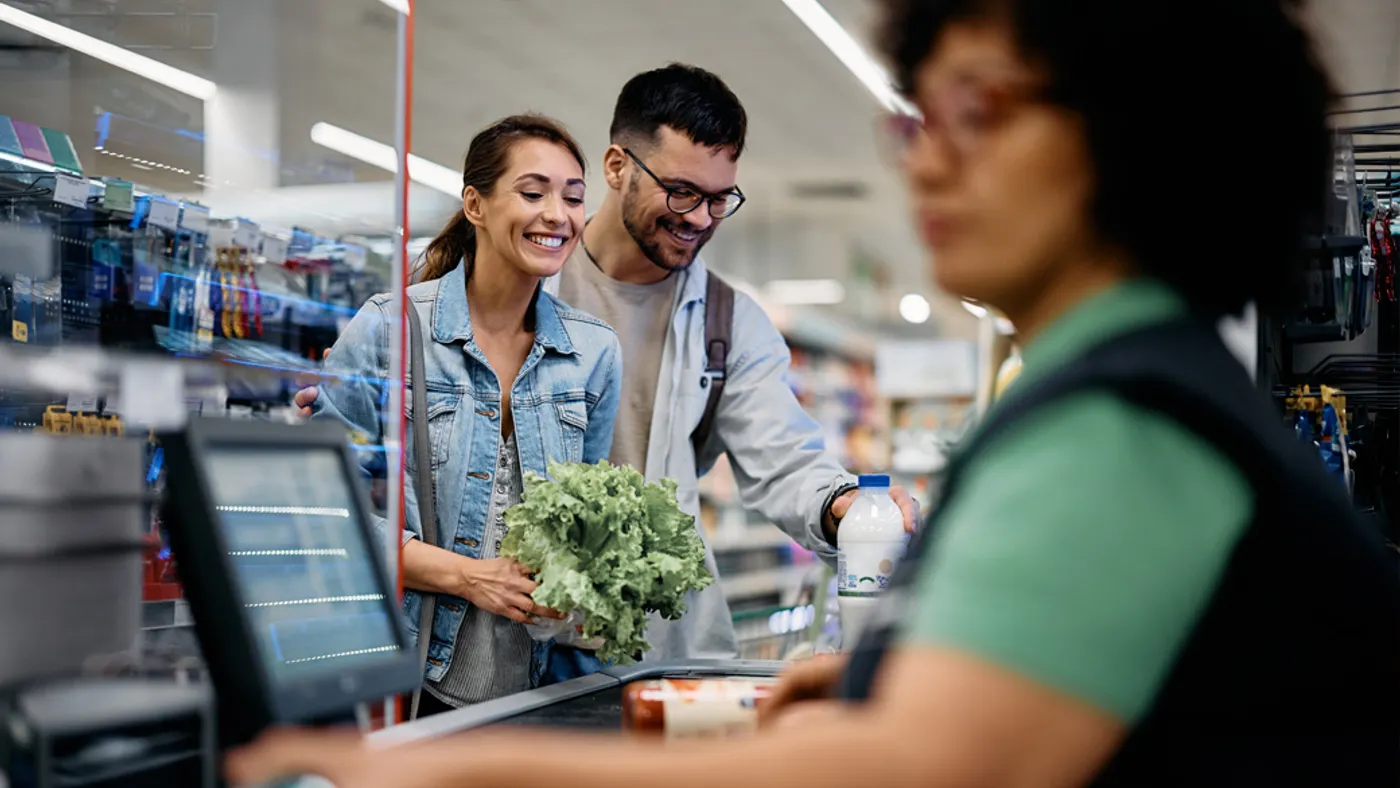 Man and women at the grocery counter