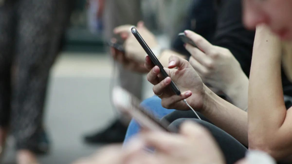 Girl with phone in hand.