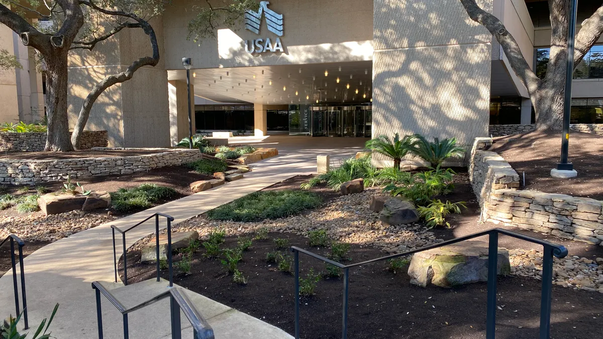 A USAA campus building is pictured with the company logo above the entrance.