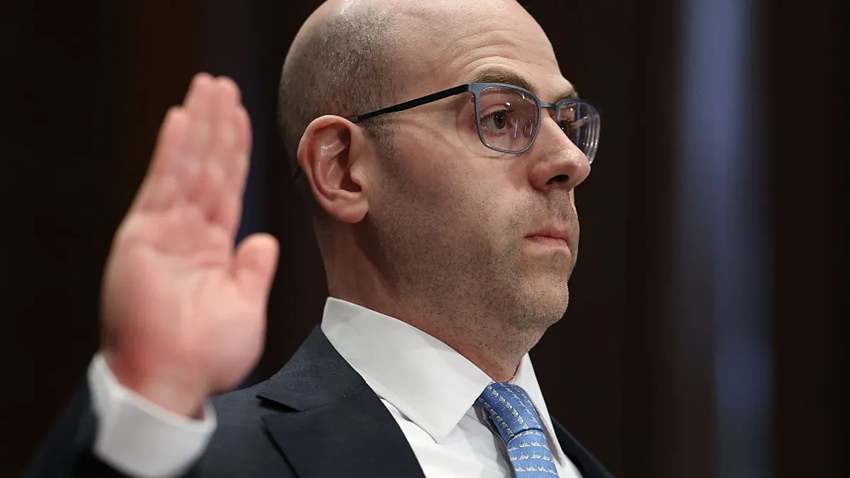 stephen miran raising hand