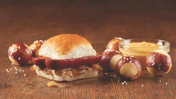 An image of a sausage slider and pretzel bites from White Castle
