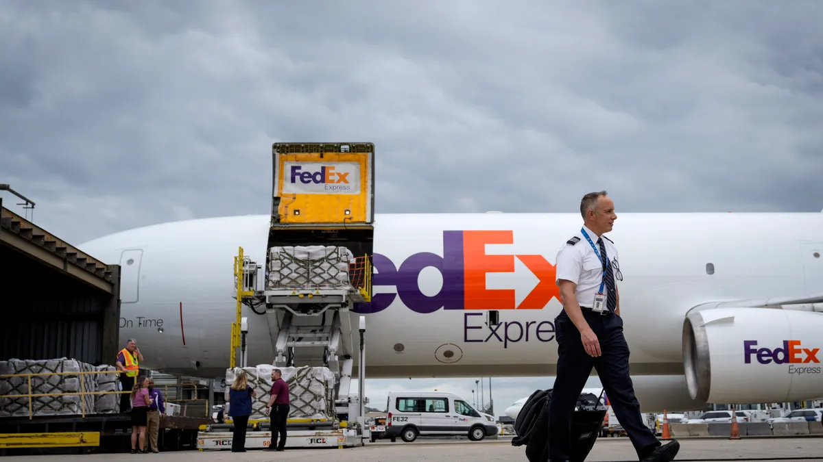 Pallets of baby formula are unloaded from a FedEx cargo plane upon arrival at Dulles International Airport on May 25, 2022 in Dulles, Virginia.