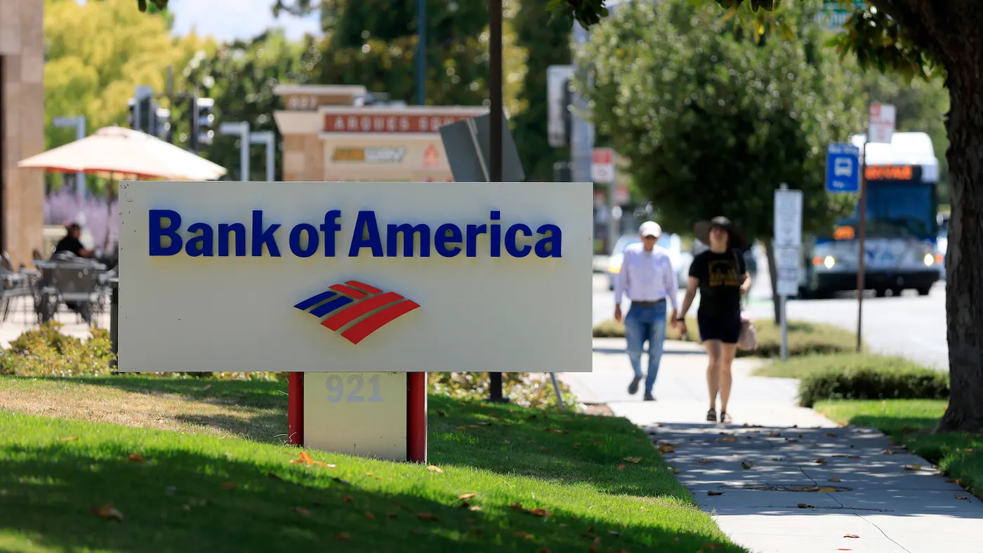 The Bank of America logo is displayed on a sign in front of a Bank of America office on July 16, 2025 in Sunnyvale, California.