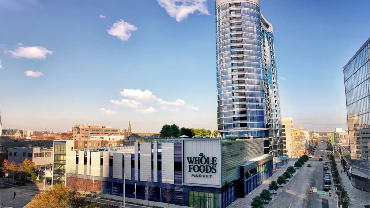 High rise building with a Whole Foods in the foreground