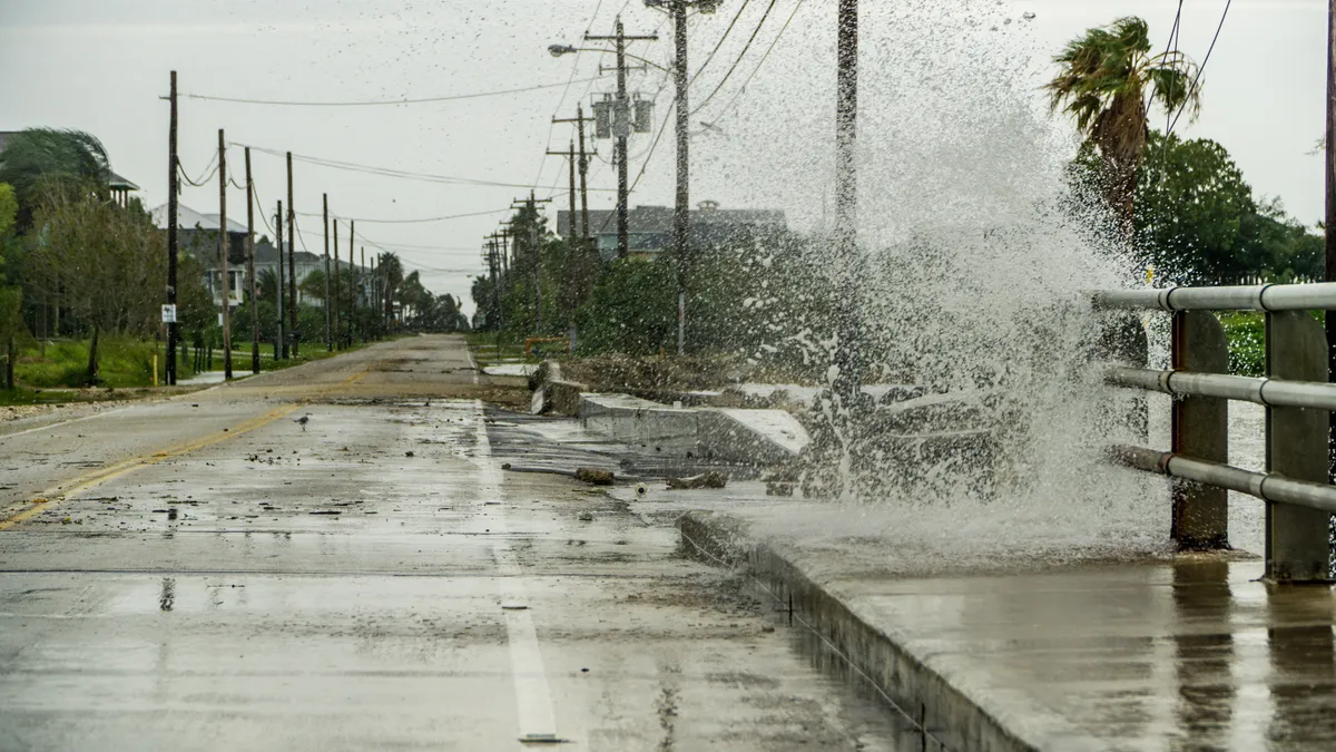 Water crashing over a road near Galveston Bay just outside of Houston Texas during Hurricane Harvey.