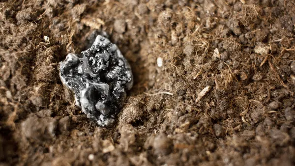 Rare earth metals emerge from the ground.