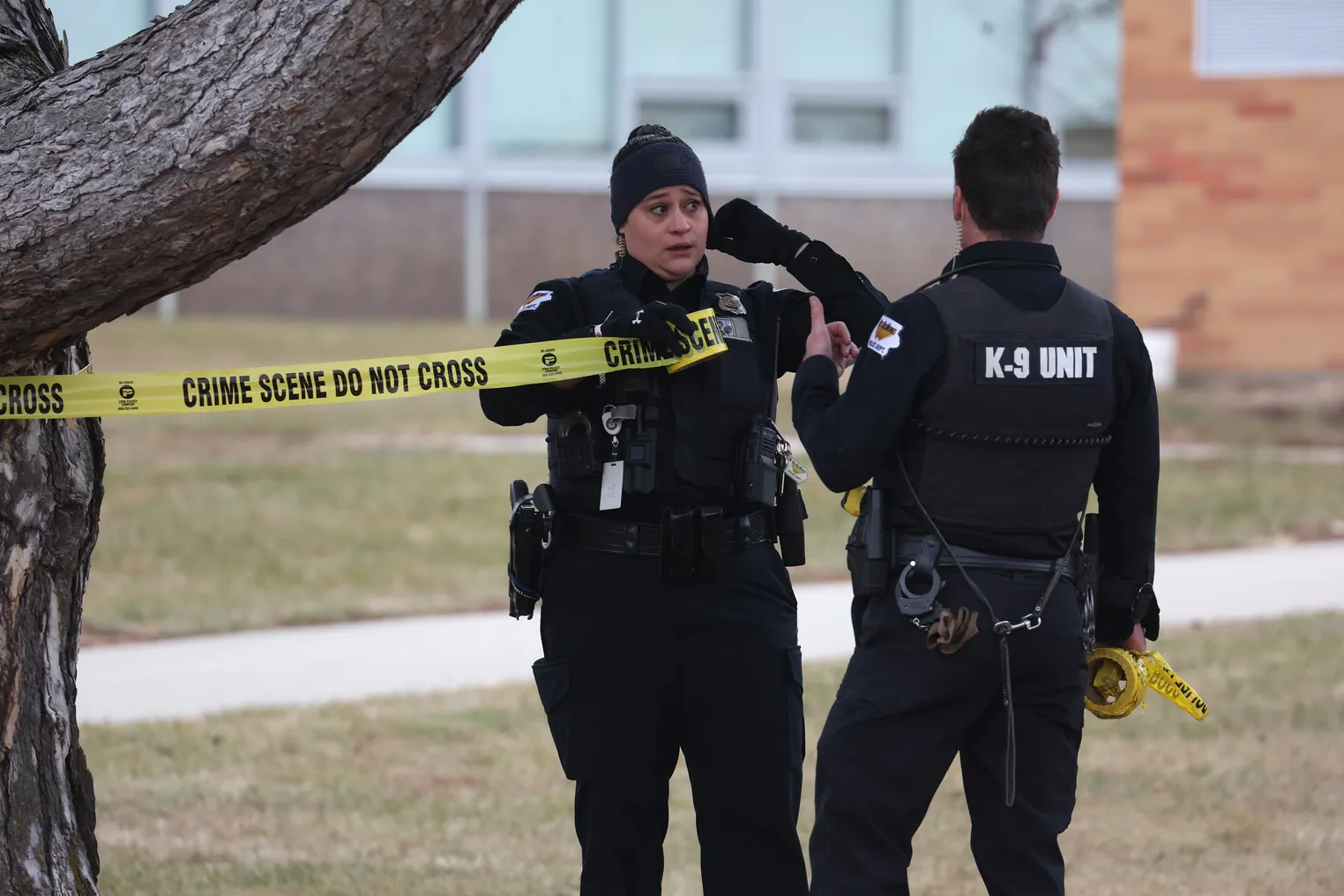 Police put up crime scene tape at Perry High School in Iowa following a school shooting on January 4, 2024.