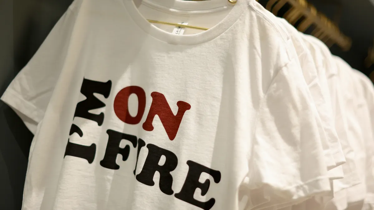 A white t-shirt that says "I'm on fire"