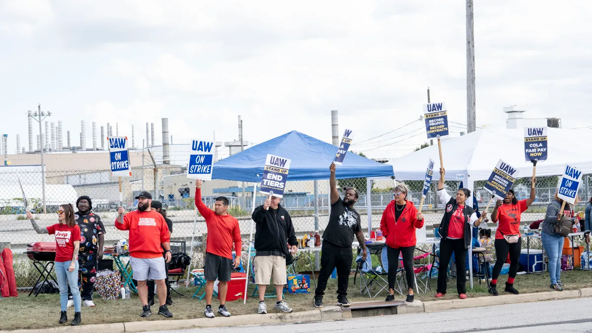 United Auto Workers members picketing.