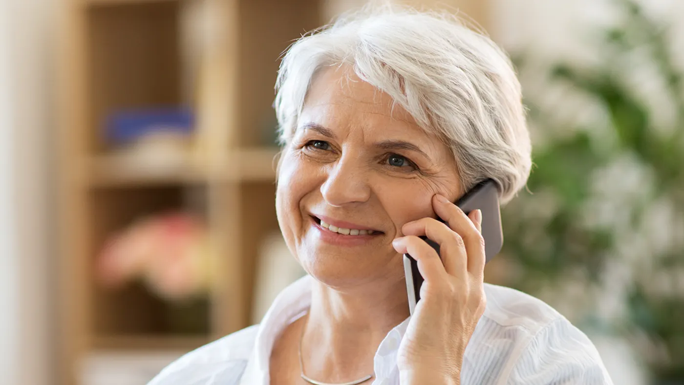 Older woman talking on phone and smiling