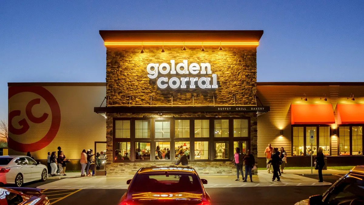 An image of a Golden Corral restaurant exterior in the evening