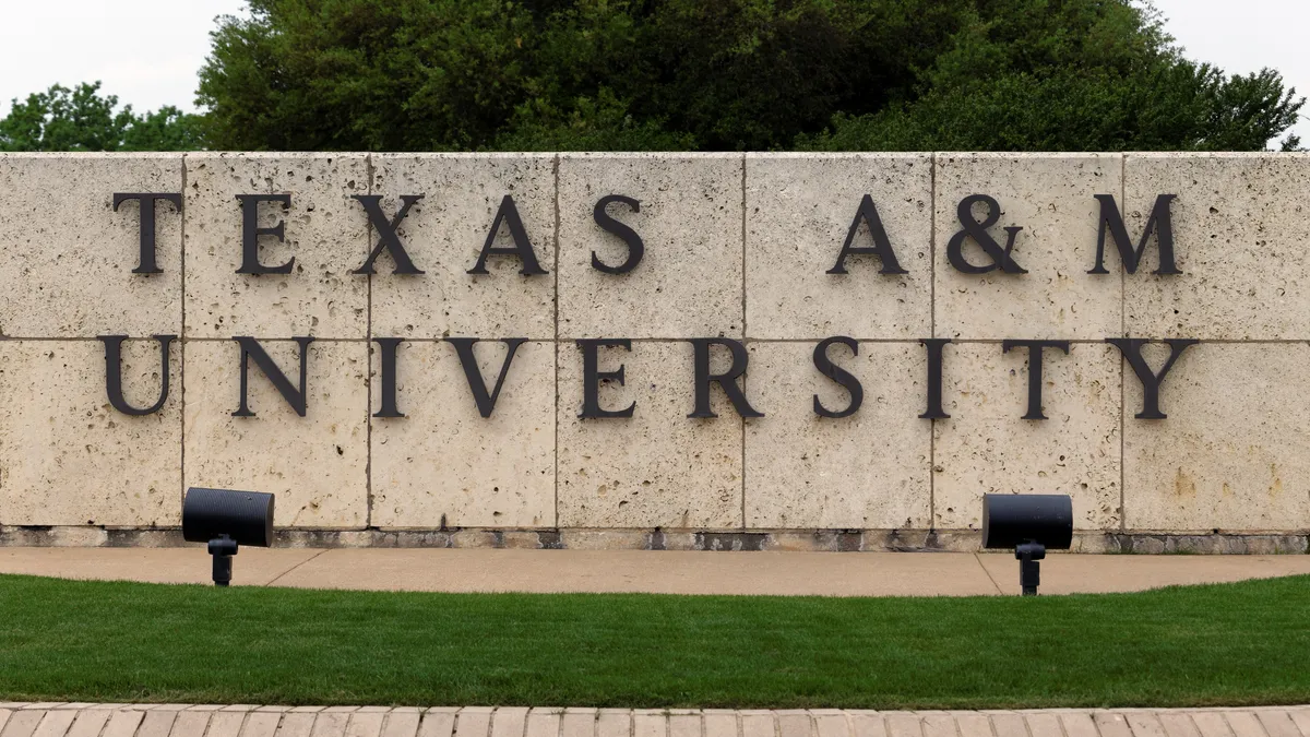 A sign bearing Texas A&M University's name at the institution's entrance.