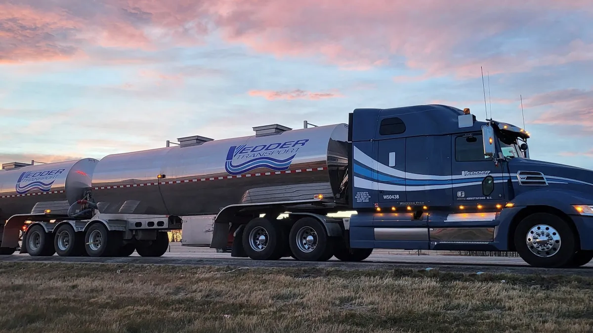 A Vedder Transportation Group truck pulls two tankers.