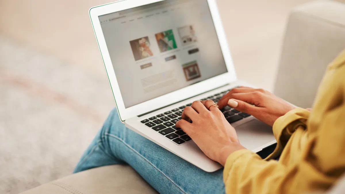 A person shops on their computer