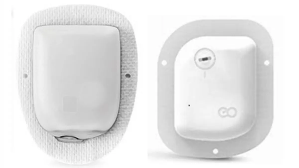 Two devices are side by side. Both are white, rectangular and have a circular sticker around the periphery.