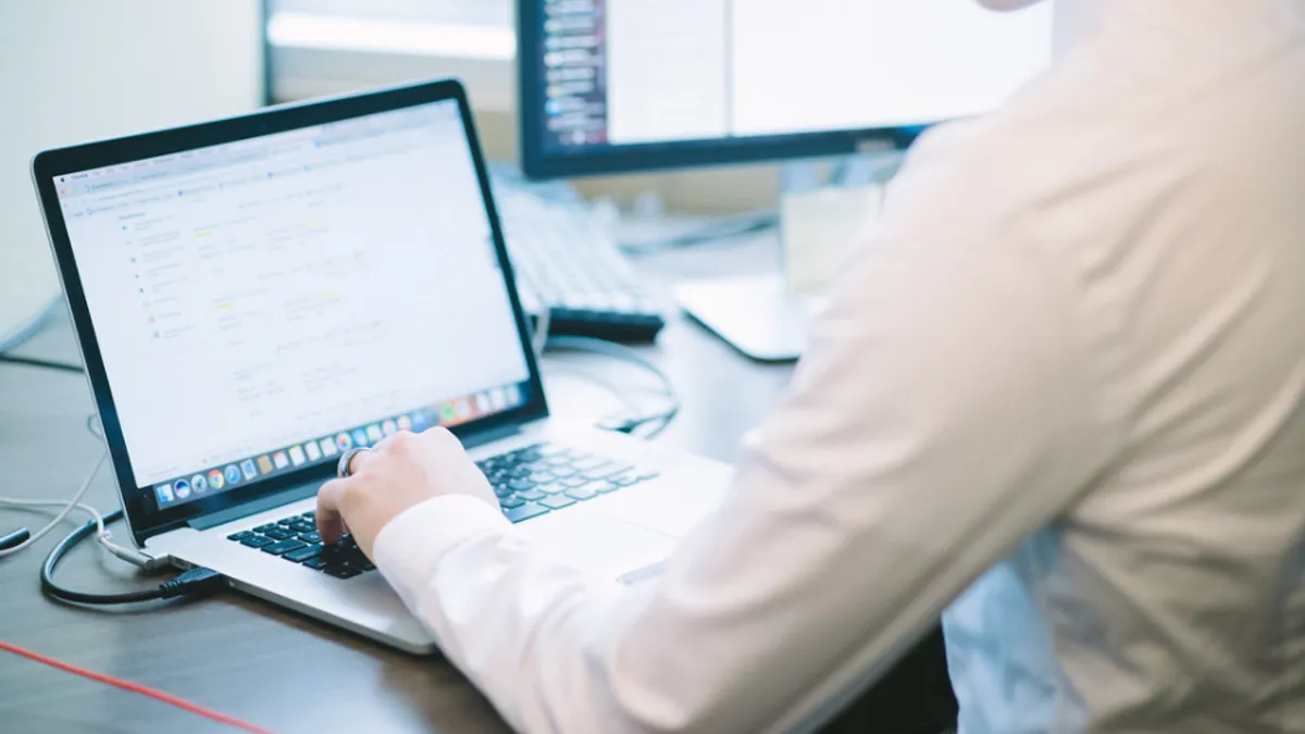 man working on laptop