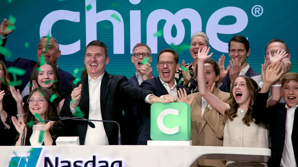 A crowd celebrates during Chime's initial public offering at the Nasdaq MarketSite.